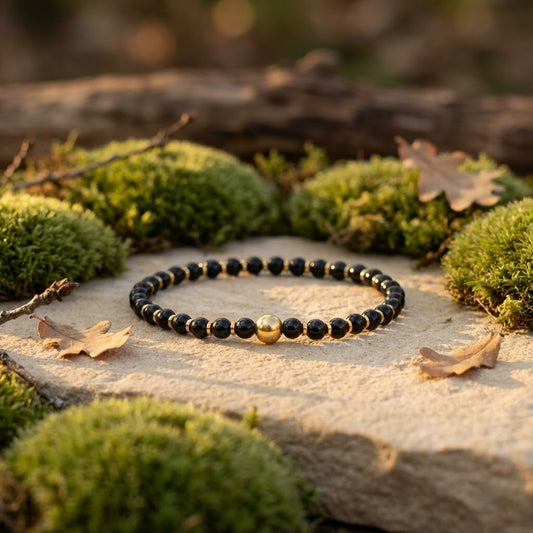 elastische edelsteen armband met obsidiaan kralen en dq gouden spacer en sierkraal